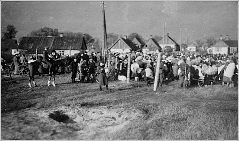 Jews are gathered at an assembly point during a deportation action in the Augustow ghetto in Bialystok